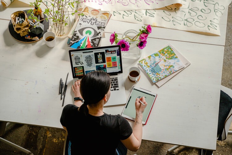 Overhead view of person working from home office 