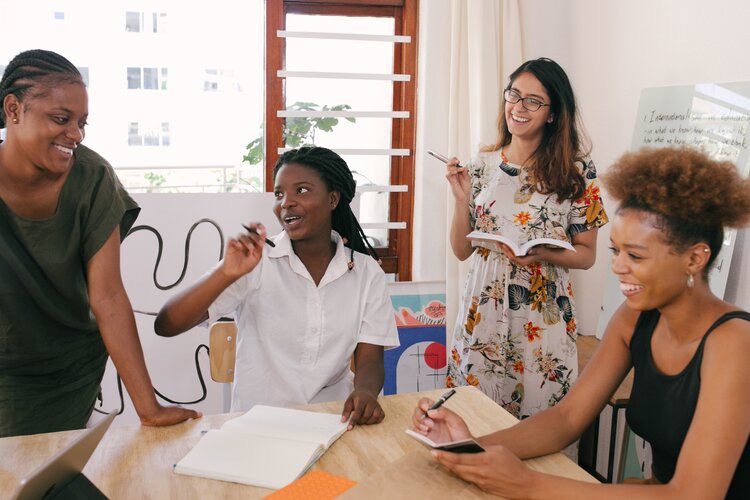 Several women brainstorming together 